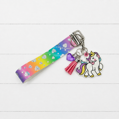 Pastel Unicorn Keychain and Wristlet on clean white wood background