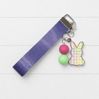 Plaid Bunny Keychain and Wristlet on clean white wood background