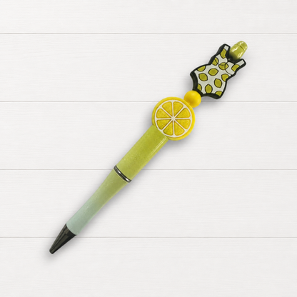 Lemon Swimsuit Beaded Pen on a clean white wood background