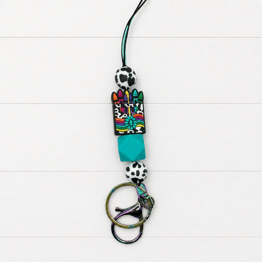 Leopard Crayons Lanyard on a clean white wood background
