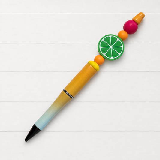 Lime Beaded Pen on a clean white wood background