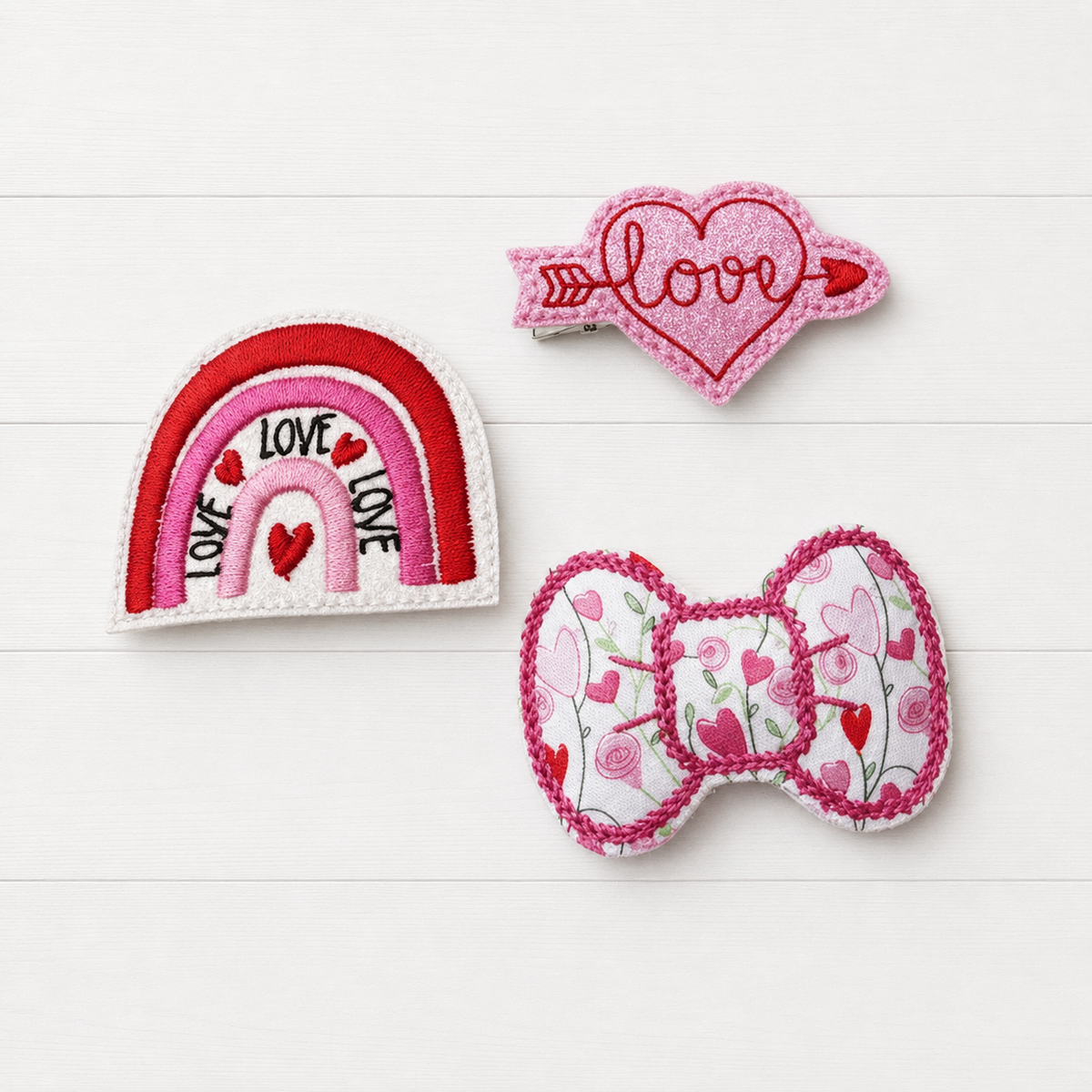 Love Rainbow and Heart Hair Clip Bow Set on a clean white wood background