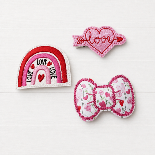 Love Rainbow and Heart Hair Clip Bow Set on a clean white wood background