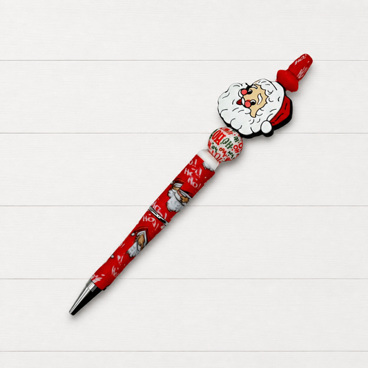 Old Fashion Santa Beaded Pen on a clean white wood background