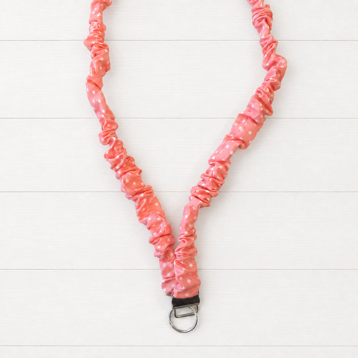 Pink Star Scrunchie Lanyard on a clean white wood background