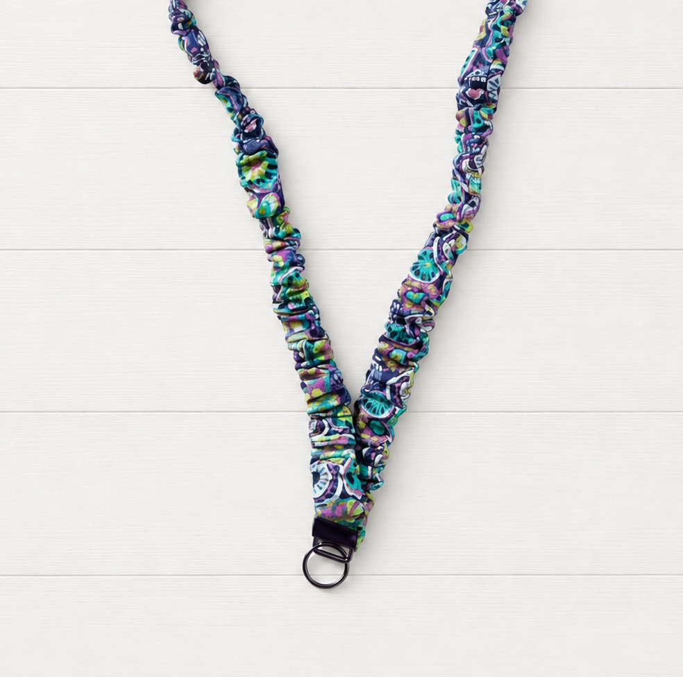 Purple Flower Power Scrunchie Lanyard on a clean white wood background