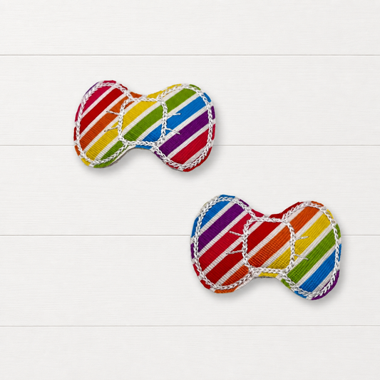 Rainbow Stripe Bow Clips on a clean white wood background