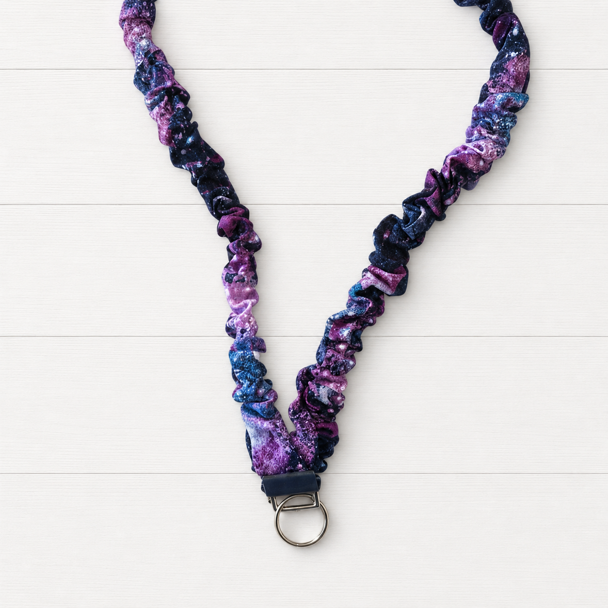Space Scrunchie Lanyard on a clean white wood background