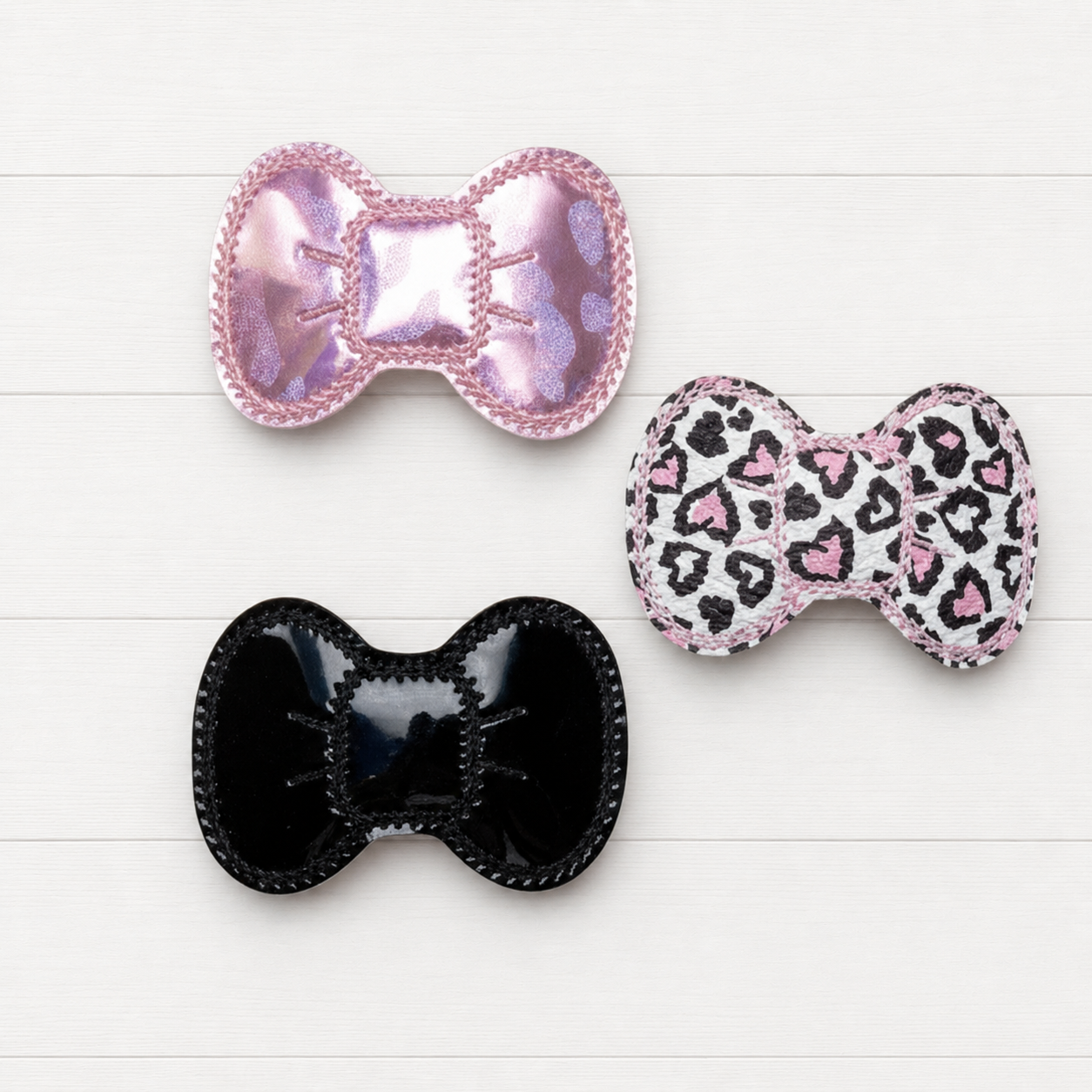 Valentine Leopard Hair Bow clip Set on a clean white wood background