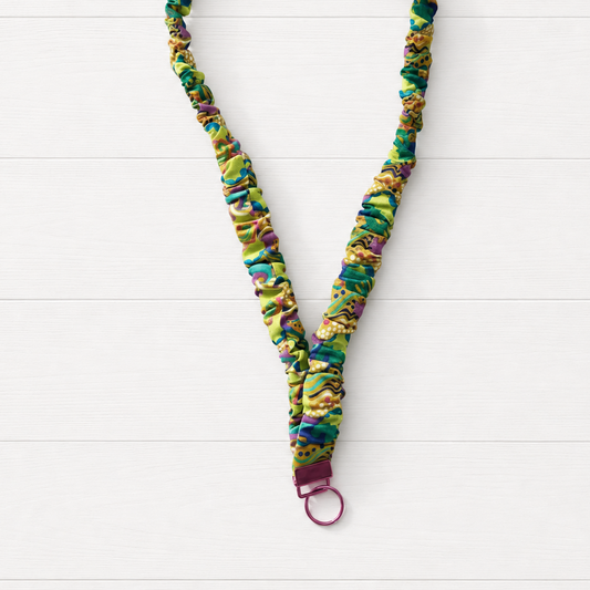 Yellow Psychedelic Scrunchie Lanyard on a clean white wood background