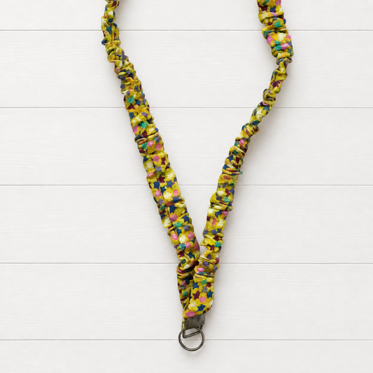 Yellow Stars Scrunchie Lanyard on a clean white wood background